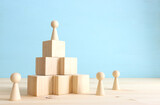 Fototapeta Do przedpokoju - business concept image of people figures over wooden blocks and table, human resources and management concept