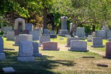 A Variety Of Different Style Headstones And Gravestones At A Cemetery