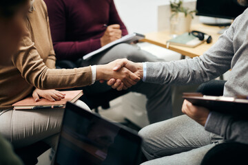 Wall Mural - Unrecognizable business people shaking hands during a meeting in the office.