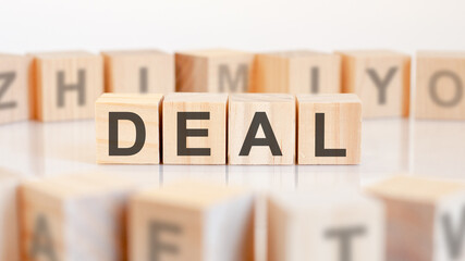 Sticker - deal - word on wooden cubes on white background, concept