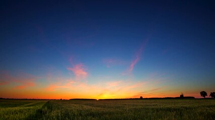 Wall Mural - 4k time lapse with colorful sky at sunset. Red clouds at sunset in footage.