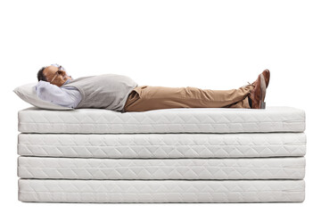 Sticker - Mature man lying on a pile of mattresses