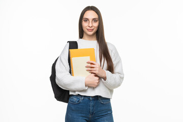 Young pretty student woman with backpack and exercise books. isolated on white background