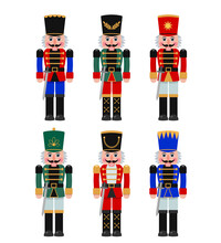 A Set Of Christmas Nutcrackers In A Red, Blue, Green Suit With A Sword.