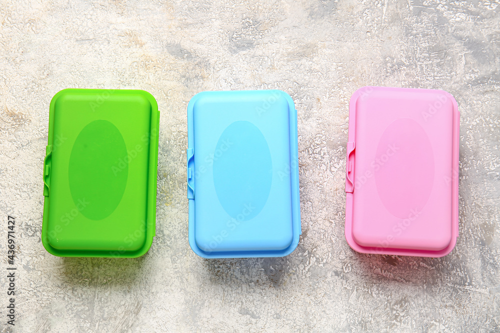 Plastic lunch boxes on light background
