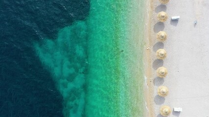 Wall Mural - aerial view on the seashore with umbrella. vacation and adventure. top view from drone at on the bea