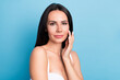 © deagreez - Photo of charming positive girl hand fingers touch cheek enjoy fresh skin isolated on blue color background