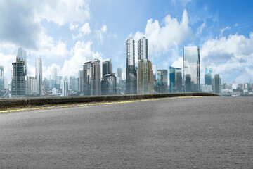 Asphalt road with modern building and skyscrapers