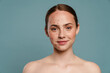 Half-naked ginger woman with pimples smiling and looking at camera