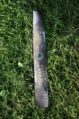 Canvas Print - Lawn Mower Blade in Grass