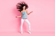 © deagreez - Full length photo of cheerful nice pretty young lady fly hair good mood dance isolated on pink color background