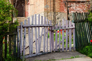 old wooden fence, white wicket and green fence