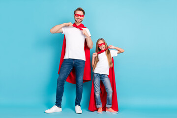 Canvas Print - Full size portrait of two persons hands fix adjust tie front toothy smile isolated on blue color background