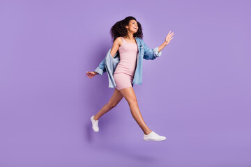 Canvas Print - Full length body size photo woman jumping running in short dress isolated pastel violet color background