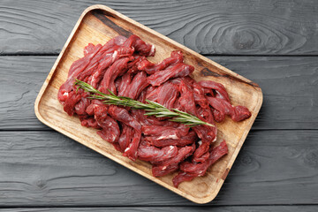 Wall Mural - Raw sliced beef meat on wooden board