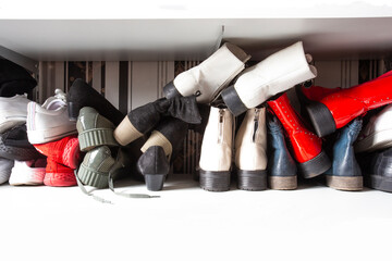 Wall Mural - Collection of old different shoes in shoe rack for storage, messy and needs organize, wardrobe with shelfs in house interior design