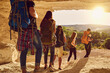 © Studio Romantic - Group of travelers hikers hiking in natural mountaints outdoors with great landscape ahead