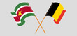 Crossed and waving flags of Suriname and Belgium