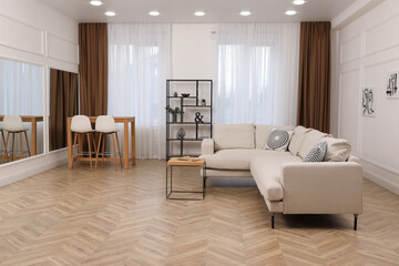 Poster - Modern living room with parquet flooring and stylish furniture