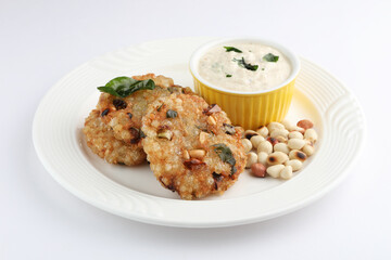 Wall Mural - Sabudana vada or Sago fried cake served with peanut chutney , popular fasting recipe from India.
