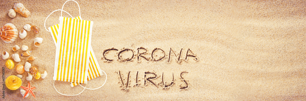 Corona virus written in the sand on vacation - obrazy, fototapety, plakaty 