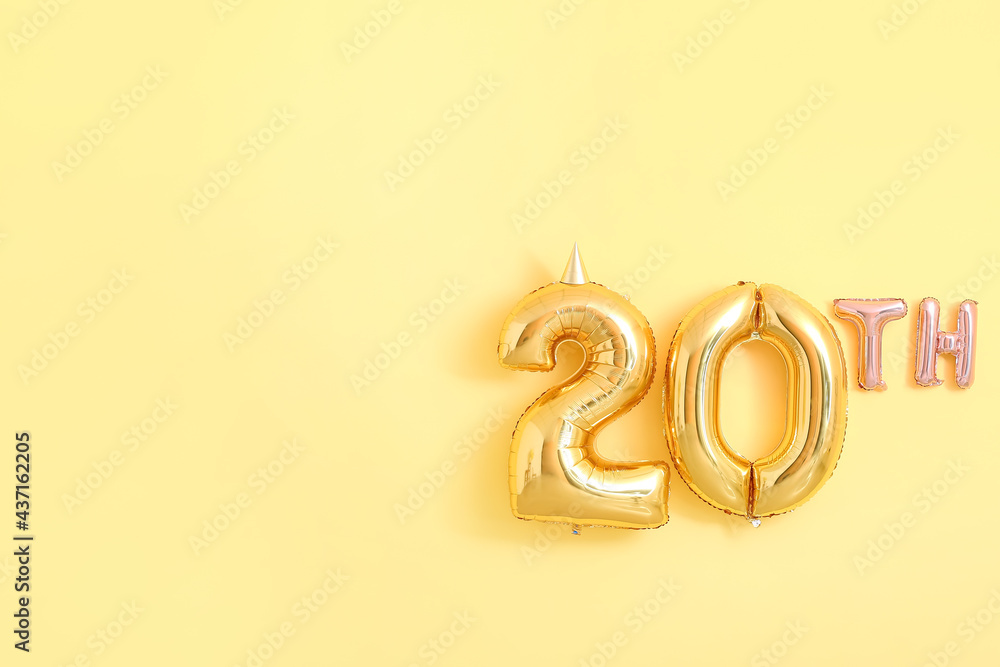 Air balloons in shape of 20TH on color background
