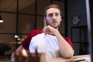 Poster - Handsome man working at home late in evening