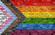 Rebooted pride flag on a brick wall - Illustration,  
Progress Pride Flag