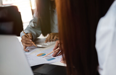 Close up business people discuss to working with using tablet and for searching information stock market chart for trading to Make a profit. Planning and Investment concept