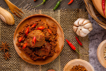 Rendang Pork or Rendang babi. 

Rendang babi is often described as a rich dish of meat  that has been slow cooked and braised in a coconut milk seasoned with a herb and spice mixture.