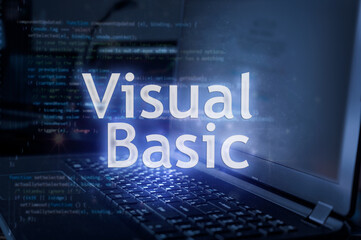 visual basic inscription against laptop and code background. learn programming language, computer co