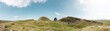 Panoramic view of Sycamore Gap Northumberland. Hadrians Wall built on tall cliffs Roman Wall on a sunny summer day