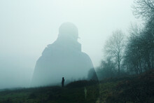 A Double Exposure Of An Atmospheric Half Transparent Man Looking At A Person Standing On The Edge Of A Forest In The Countryside. On A Moody Foggy Winters Day.