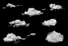 Set Of White Cumulus Clouds Isolated On Black Background.