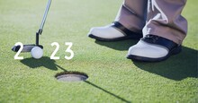 Composition Of 2023 Number With Golf Ball And Player With Golf Club On Golf Course