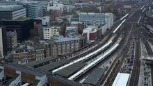 Timelapse View Of A London Station At Rush Time With Commuter, Shoppers And Trains