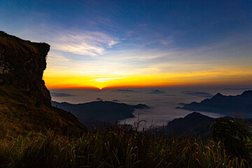 Wall Mural - Beautiful landscape nature on peak mountain with sunrise in winter at viewpoint Phu Chi Fa