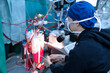 male perfusionist sitting in cardiac operating room
