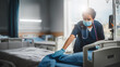© Gorodenkoff - Hospital Ward: Professional Black Nurse Wearing Face Mask, Cleaning Room After Covid-19 Patients Recover. Disinfection, Sterilizing, Sanitizing Clinic after Coronavirus Infected Sick People