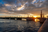 Fototapeta Kosmos - View of the Trinity Bridge over the Neva River in the first rays of the rising sun on a summer morning, St. Petersburg, Russia