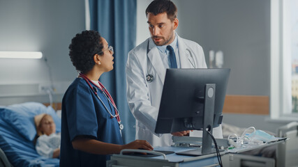 Wall Mural - Hospital Ward: Caucasian Doctor Talks With Professional Black Head Nurse, They Use High-Tech Computer. In Background Patient in Bed Recovering after Successful Surgery. Health Care Specialists