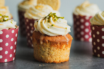 Wall Mural - Vanilla cupcakes with cream and caramel