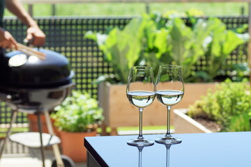 summer evening drinks and barbecue on a cozy terrace, Austria, 2021.