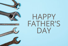 Happy Father's Day Banner. Different Wrenches On Blue Background.