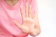© Oporty786 - Close-up female hand showing stop sign with five fingers spread, sign language concept.