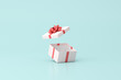 © nuchao - 3D rendering of open gift box on green background.