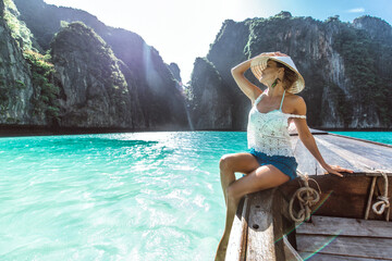 Wall Mural - Beautiful woman making an excursion to phi phi island and maya beach in Thailand