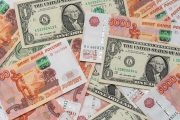 One dollar and five thousand rubles cash banknotes. Business concept