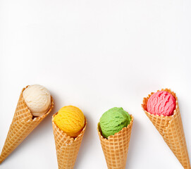 Wall Mural - Assorted of ice cream in cones on white background. Colorful set of ice cream of different flavours. Ice cream isolated for your design