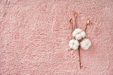 Branch Cotton On Pink Towel Texture Background With Copy Space. Nature Background. Flat Lay, Top View Of Cotton. Natural Textile.
